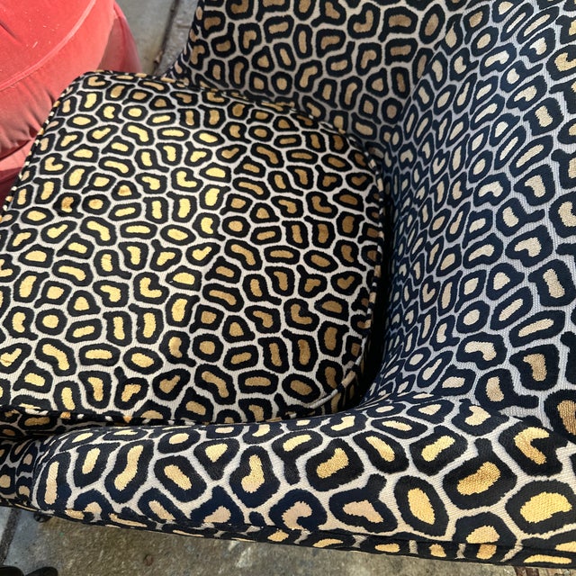 They’re a stylish pair of vintage club / barrel-back accent chairs with a low, loungey profile and gently flared arms. The...