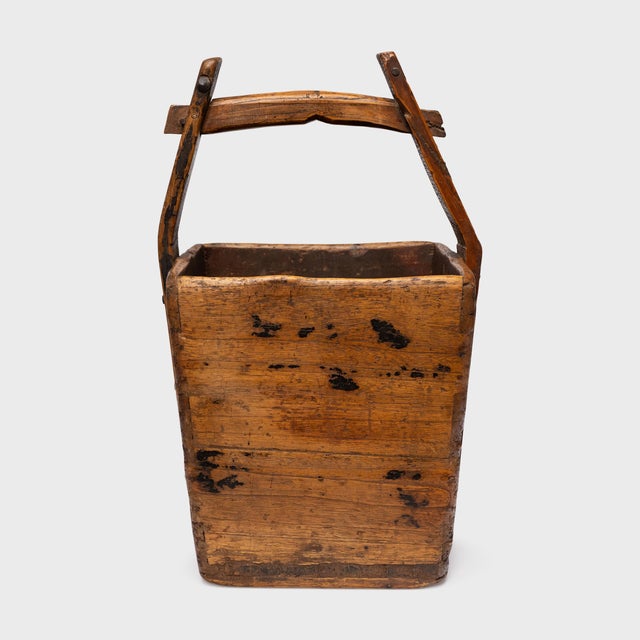 This antique wooden bucket was once used by farmers in provincial China to transport their harvest of rice and grains over...