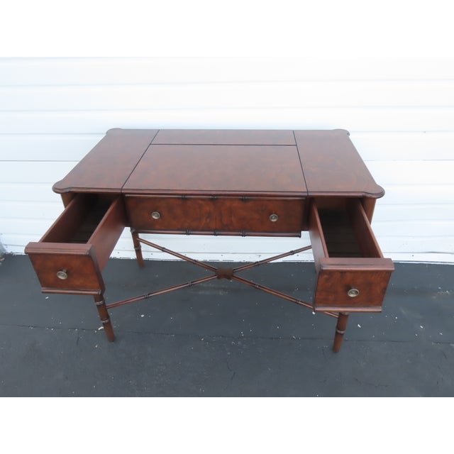 This high quality Desk is made of wood, solid wood, burlwood, and veneer. We believe it was made by Henry Link, however it...