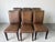 Stylish set of six 1980s Italian dining chairs by Stone International, featuring beautifully handwoven leather seats and...