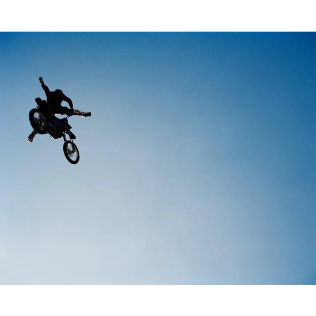 Andy Ryan, Man Performing Stunts on Motorcycle, Photograph, in Flawless conditions. Designed from 2000 This piece has an...