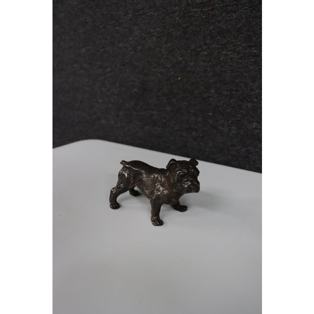 Sterling silver figurine depicting a standing English bulldog. The sculpture features detailed facial folds, a broad...