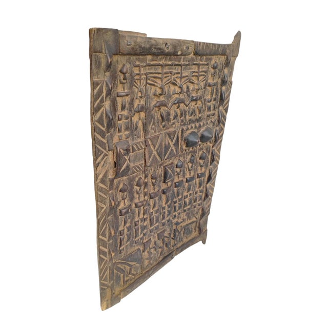 This remarkable vintage granary door from Mali showcases Dogon tribe ancestors alongside with breasts It measures 23.5" H...