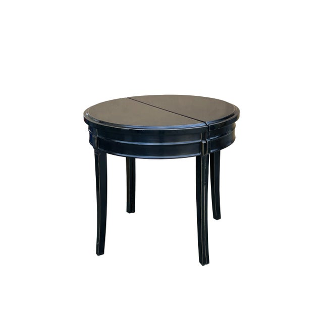 This is a pair of oriental half-round pedestal tables made of solid wood and finished in black lacquer. It can be used as...