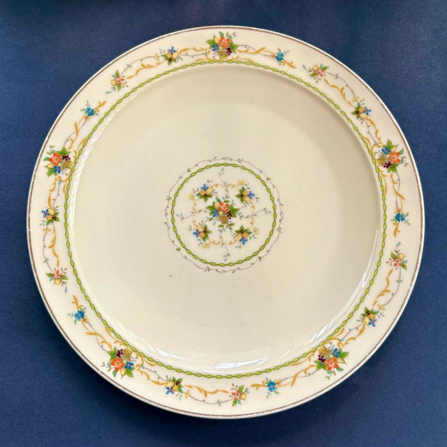 A refined vintage dinner plate from Noritake in the beloved “Normandy” pattern (8162 / W83), featuring delicate multicolor...