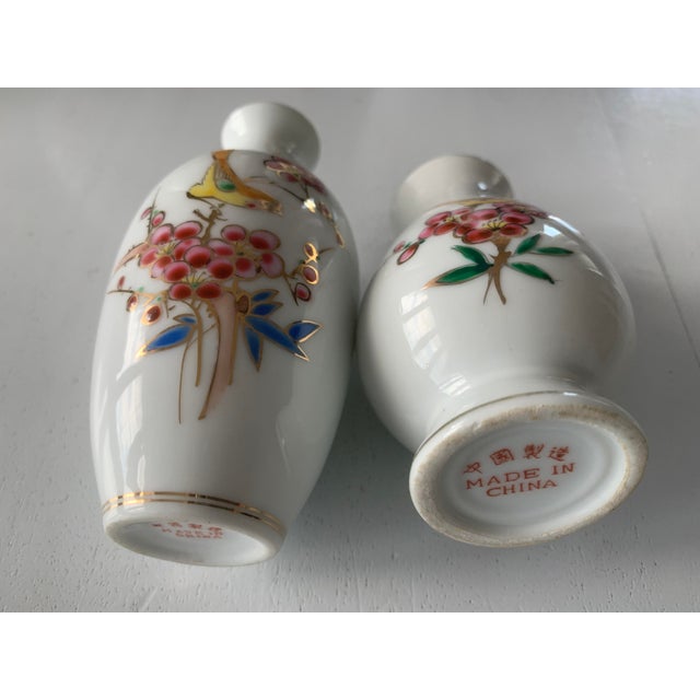 Set of Chinese porcelain vases. Two pieces from the mid-20th century Visible in the photos. Dimensions: Height - 12 cm....