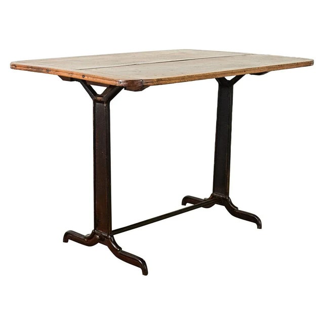 Dimensions: 29 ⅜” H x 43 ¼” W x 29 ¾” D Vintage French bistro table from the early 20th century featuring a solid poplar...