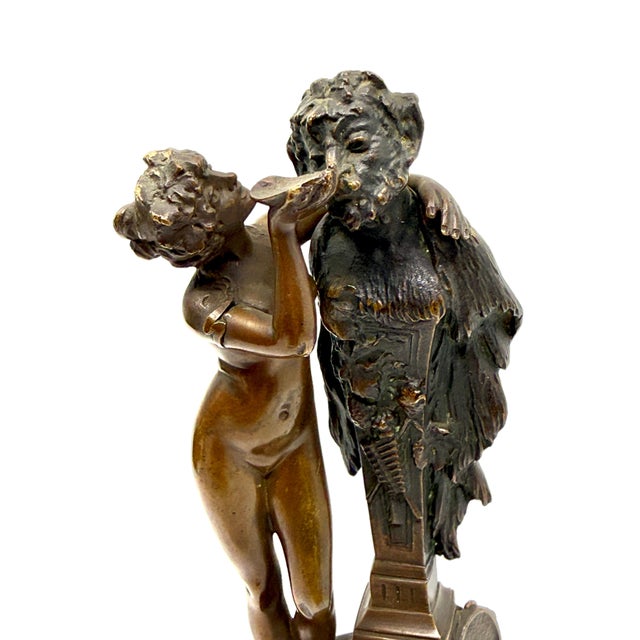 A nice neoclassical grand tour souvenir of a Nymph giving Pan a drink of water. Nicely cast and mounted on a marble base....