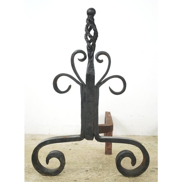 Antique French style andirons made of cast iron with a twisted cage finial on vertical posts. Andirons, also known as...