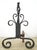 Antique French style andirons made of cast iron with a twisted cage finial on vertical posts. Andirons, also known as...