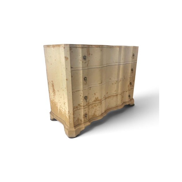 This chest has a distinctive multi-lobed, undulating wavy façade or "block-front" silhouette, combining classical European...
