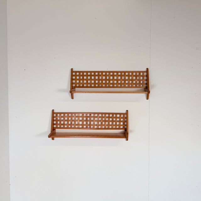 This set of two vintage wall shelves was designed and manufactured by the Czechoslovakian design collective ÚLUV in the...