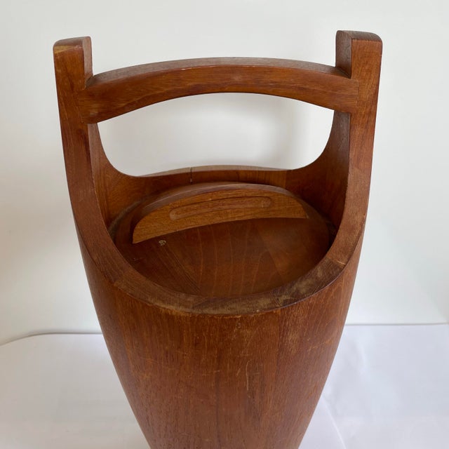 A vintage 1960’s ice bucket designed by Jens Quistgaard for Dansk. The bucket was crafted from richly grained staved teak...