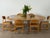 Round dining table in ash from the 1970s, designed with two extension leaves that transform the circular top into a...