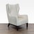 This Holly Hunt lounge chair features a stylish wingback design and is upholstered in a soft, textured cream fabric. Its...