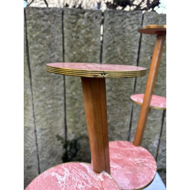 Large vintage flower stand/bench from the 1950s/60s in a striking V-shape. It features five round shelves in a kidney-...