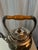 This is a beautiful English silver teapot with separate tilting warmer stand. The only mark I found is shown in the...