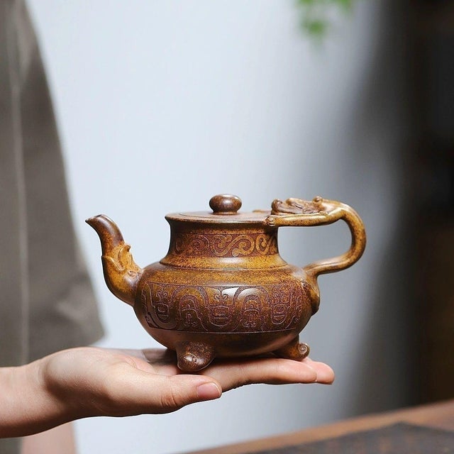 This distinctive Yixing Zisha vessel is a finely handcrafted piece that functions as both a wine pot and tea pot, inspired...