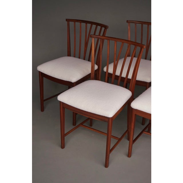 A rare set of four dining chairs designed by Dutch modernist Elmar Berkovich for Zijlstra te Joure. Upholstered in a New...