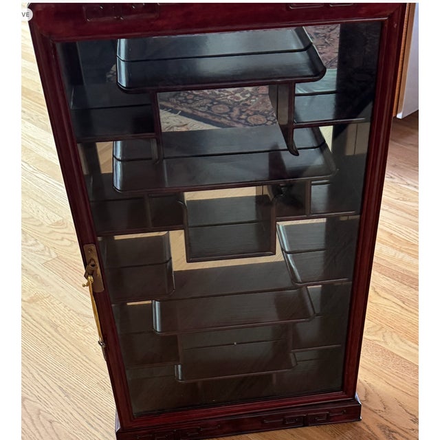 Chinese Rosewood Curio Display Cabinet with Geometric Shelving A beautifully crafted Chinese-style display cabinet...