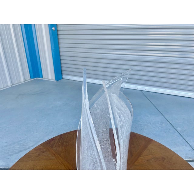 Mid-century acrylic table lamp designed and manufactured in the United States circa 1960s. This stunning lamp features an...