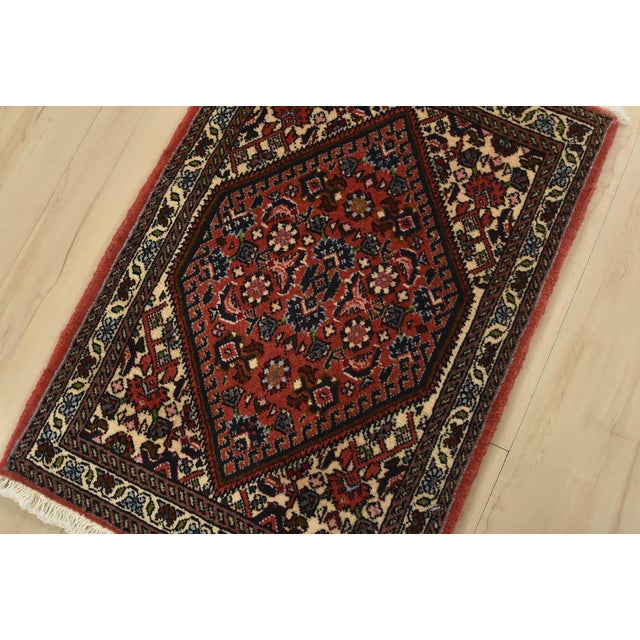An authentic vintage traditional Bidjar rug hand-knotted with fine wool and natural dyes. This intricately woven oriental...