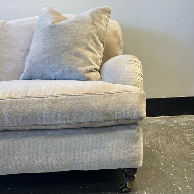 Ralph Lauren Roll Arm Sofa with Turned Brass Casters. Kiln-dried Hardwood Frame. 8-way hard tied springs. Down blend seat...