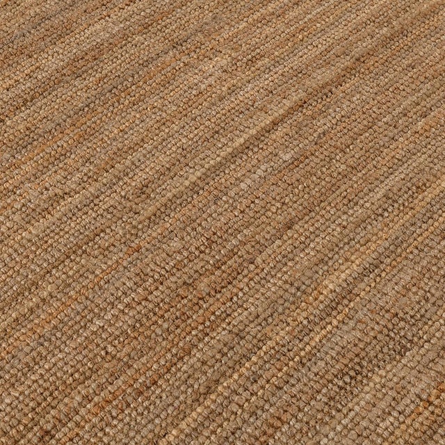 Hand woven boucle inspired soft jute rug in natural tones. Available in numerous sizes. Please note that its appearance...