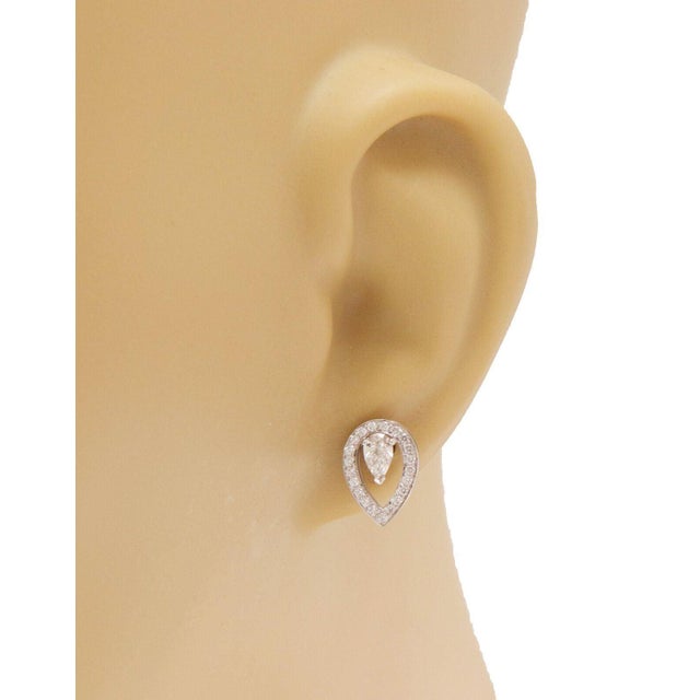 The Fred of Paris Lovelight Pear Shaped Diamond Earrings are fine jewelry pieces crafted from 18k white gold with a...