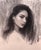 The portrait depicts a young woman with long, flowing hair, rendered in rich charcoal and graphite on toned paper. The...