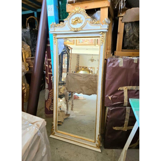 Make an unforgettable statement with this magnificent French Neoclassical floor mirror, beautifully crafted with an...