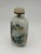 Inside-painted bottles, where artists use specially curved brushes to paint intricate scenes on the interior surface of...