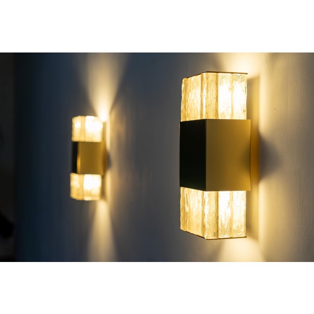 Elegant and rare pair of glass wall sconces by Jean Perzel. Designed and crafted in France, these timeless pieces embody...