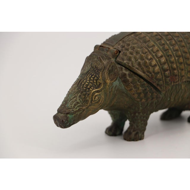 Circa: 19th Century. Origin: England. Material: Bronze. Item condition: The porcelain inkwells are missing. Signs of...