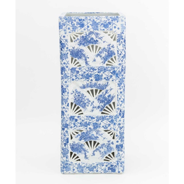 Chinese Blue and White Porcelain Umbrella Stand, of pierced elongated square form with fan design, decorated allover with...