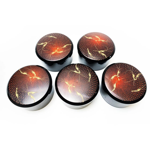 What a beautiful storage solution! This set includes 5 medium sized round lacquerware boxes with high gloss black bodies...