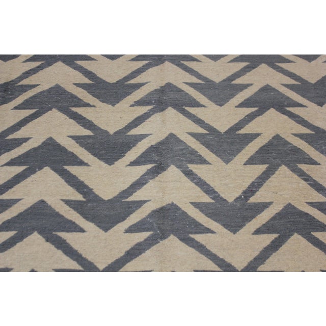 A beautiful hand knotted modern kilim, made of 75% wool & 25% cotton, dyed with all natural dyes made from vegetable...