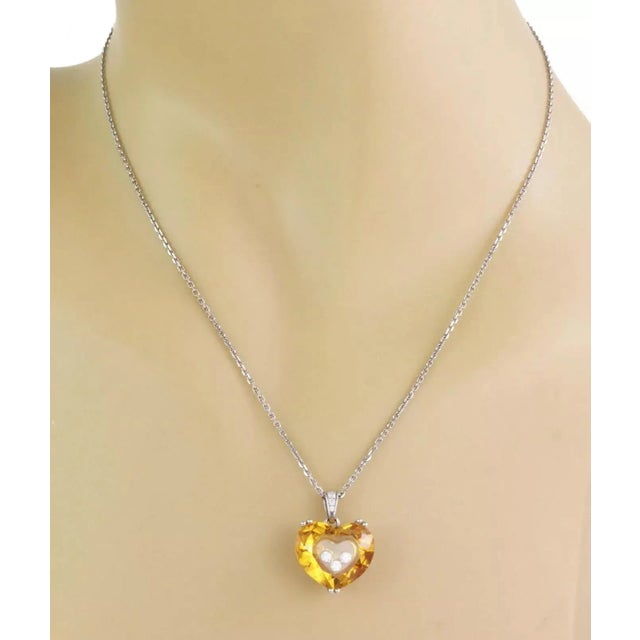 This gorgeous pendant and chain is by Chopard from the So Happy Diamond collection. Crafted from 18k white gold with a...