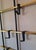 Mid century large wall mounted coat and hat rack in brass, brass-overlay and metal with 12 plastic shaped hooks that can...
