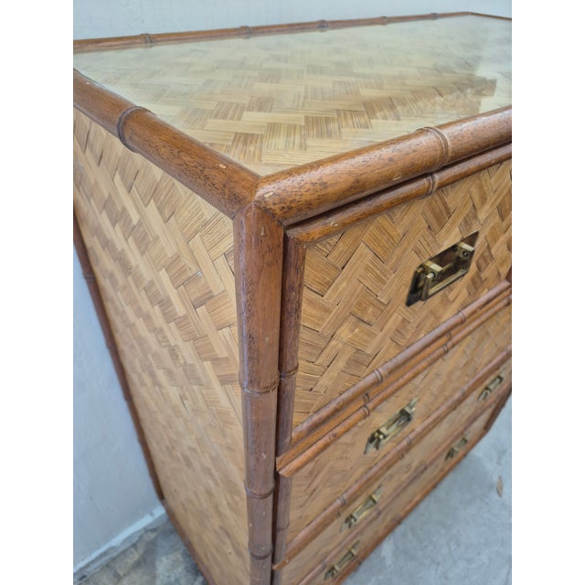 BoHo Chic Itailian chest of drawers crafted with grasscloth and faux bamboo with campaigne style brass hardware.