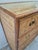 BoHo Chic Itailian chest of drawers crafted with grasscloth and faux bamboo with campaigne style brass hardware.