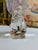 A beautifully sculpted Baccarat signed crystal rabbit, captured in a charming upright pose on its haunches with ears...