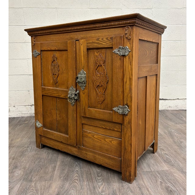 This is an antique early 1900s American oak and metal ice box chest cabinet in an unusually large size. These were the...