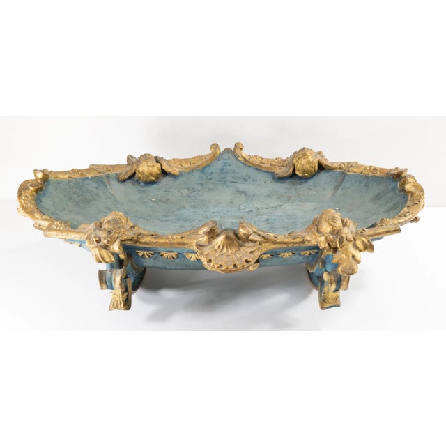 We are selling this gorgeous Blue and Gold carved wood display bowl or cradle. We believe this rocking bowl was probably...