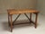 A rare antique Italian work table featuring a unique and functional design detail: two carefully carved V-shaped grooves...