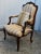 Vintage (1980s) Arm Chair has a French Style. The Frame is Wood. Ornately Carved. Stripe Fabric. The Measurements: 26"W x...