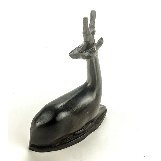 Lovely vintage hand carved wood figurine in the shape of a doe or deer. Possibly a gazelle from the African safari wild...