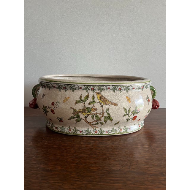 Large vintage ceramic jardinière featuring a charming bird-and-berry motif with leafy branches, flowers, insects, and...