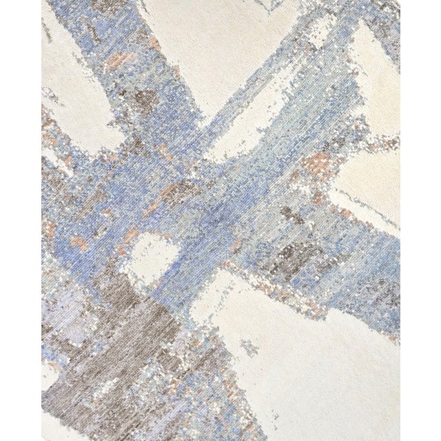 Beautiful hand knotted modern and fashionable collection of borderless designs rug, made of 75% wool and 25% cotton. This...