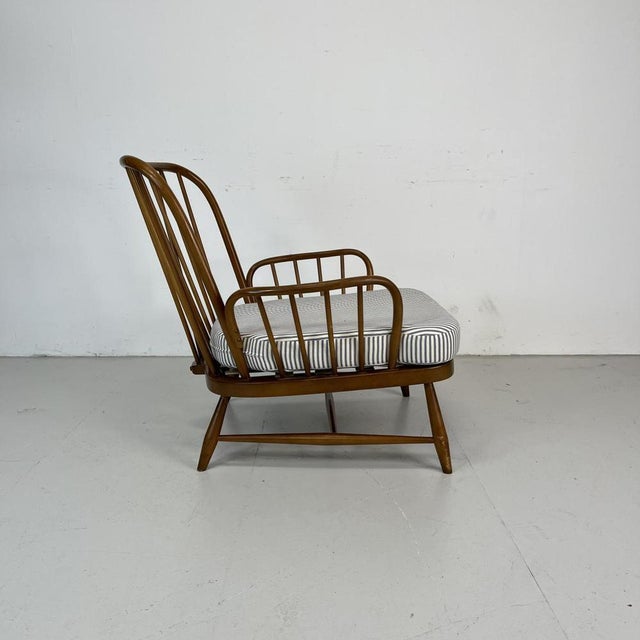 Refurbished vintage Ercol Jubilee armchair, upholstered in French ticking. This piece is in good vintage condition. The...